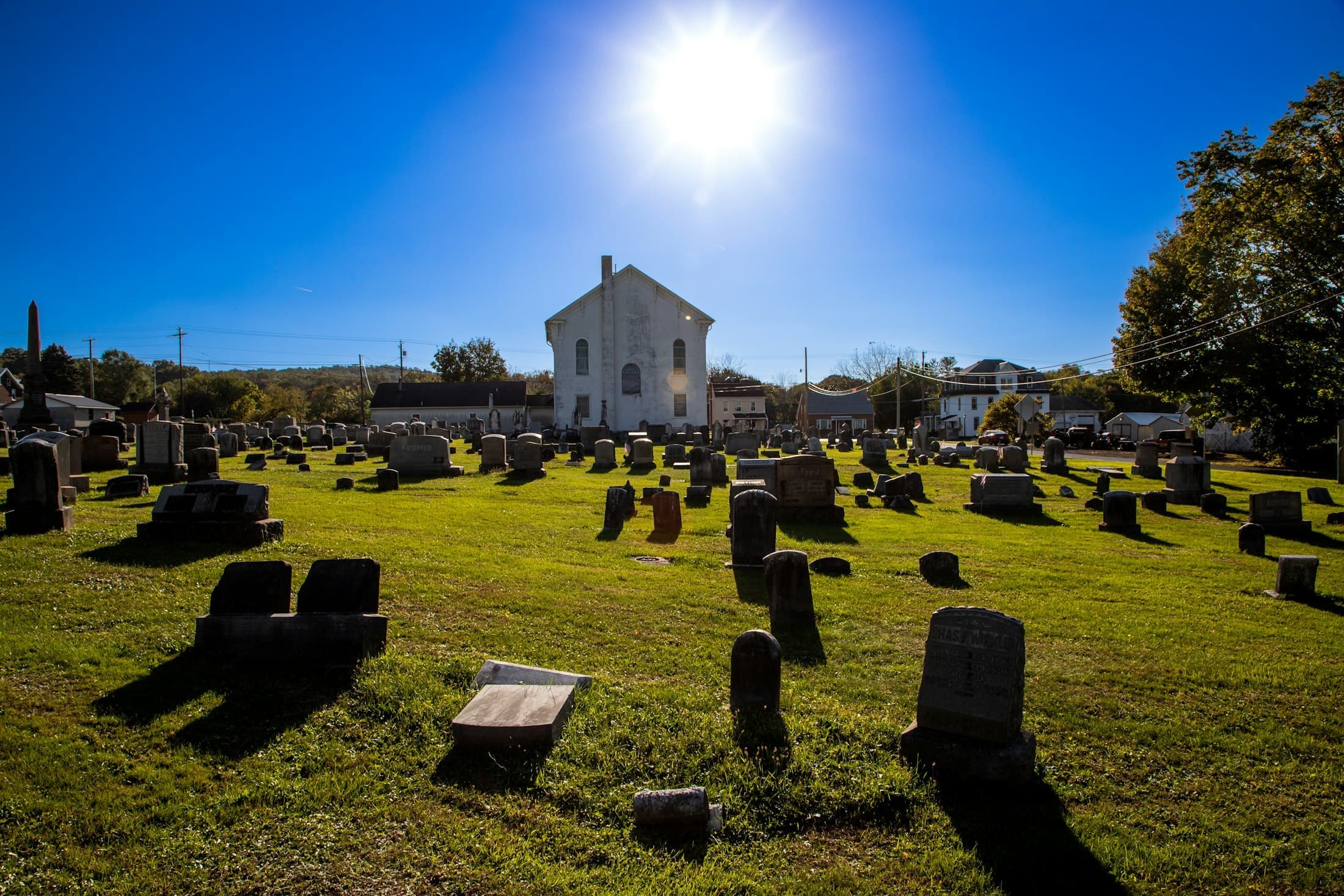 Churchyard with chapel under a bright sky