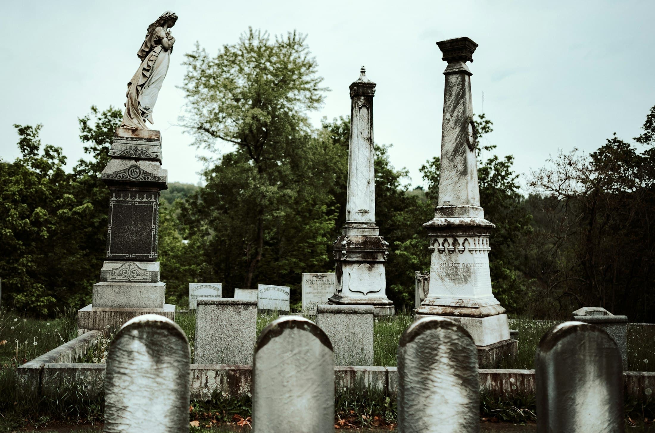 Classical monuments and obelisks in a mature cemetery