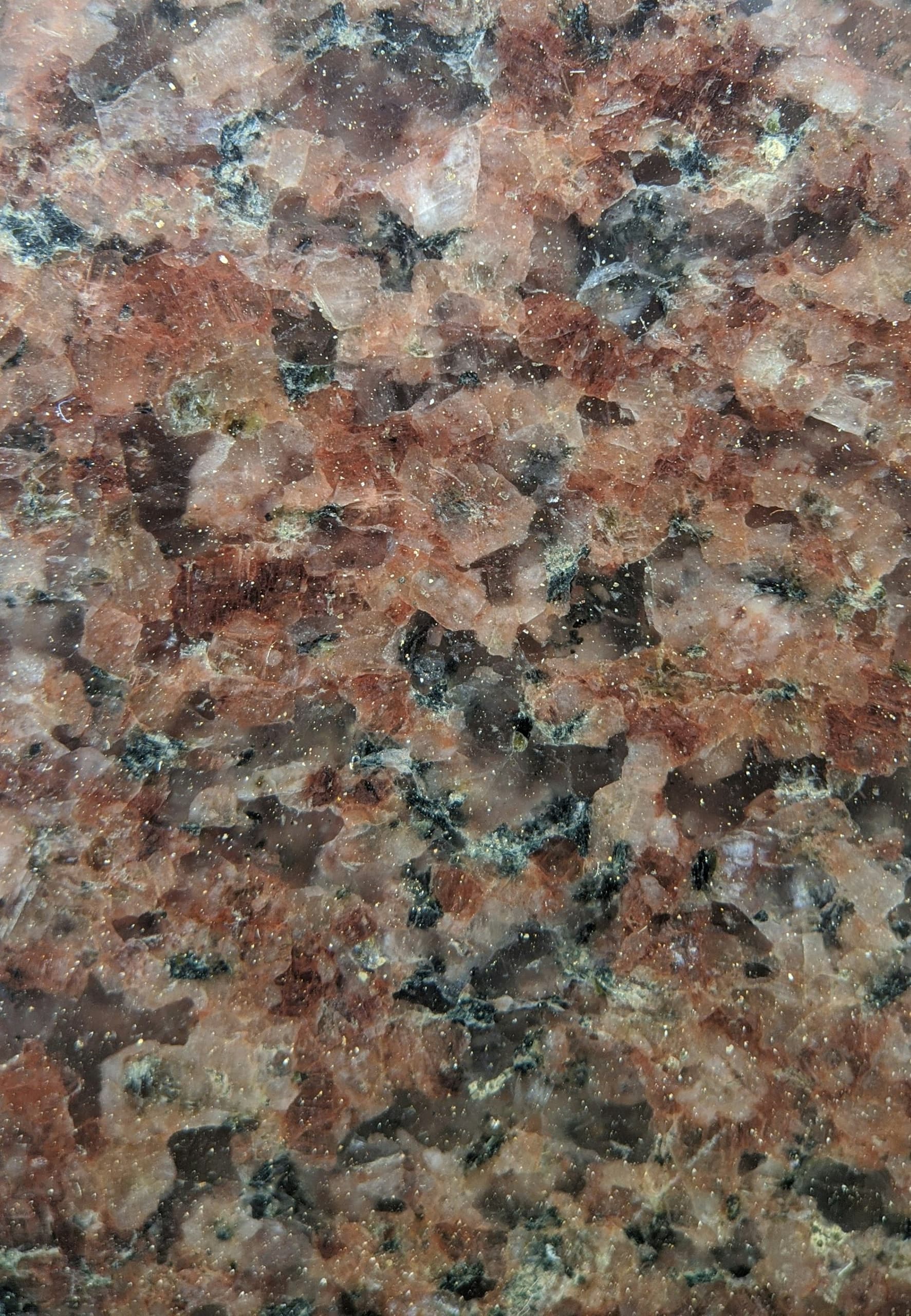 Autumn Rose granite with red and black crystals